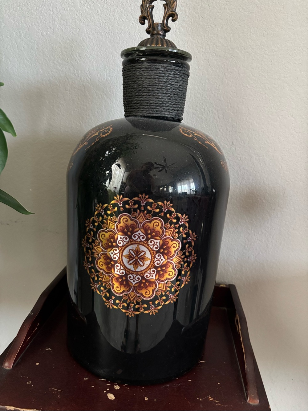 Deco 79 glass stopper bottle with Gold Medallion Design